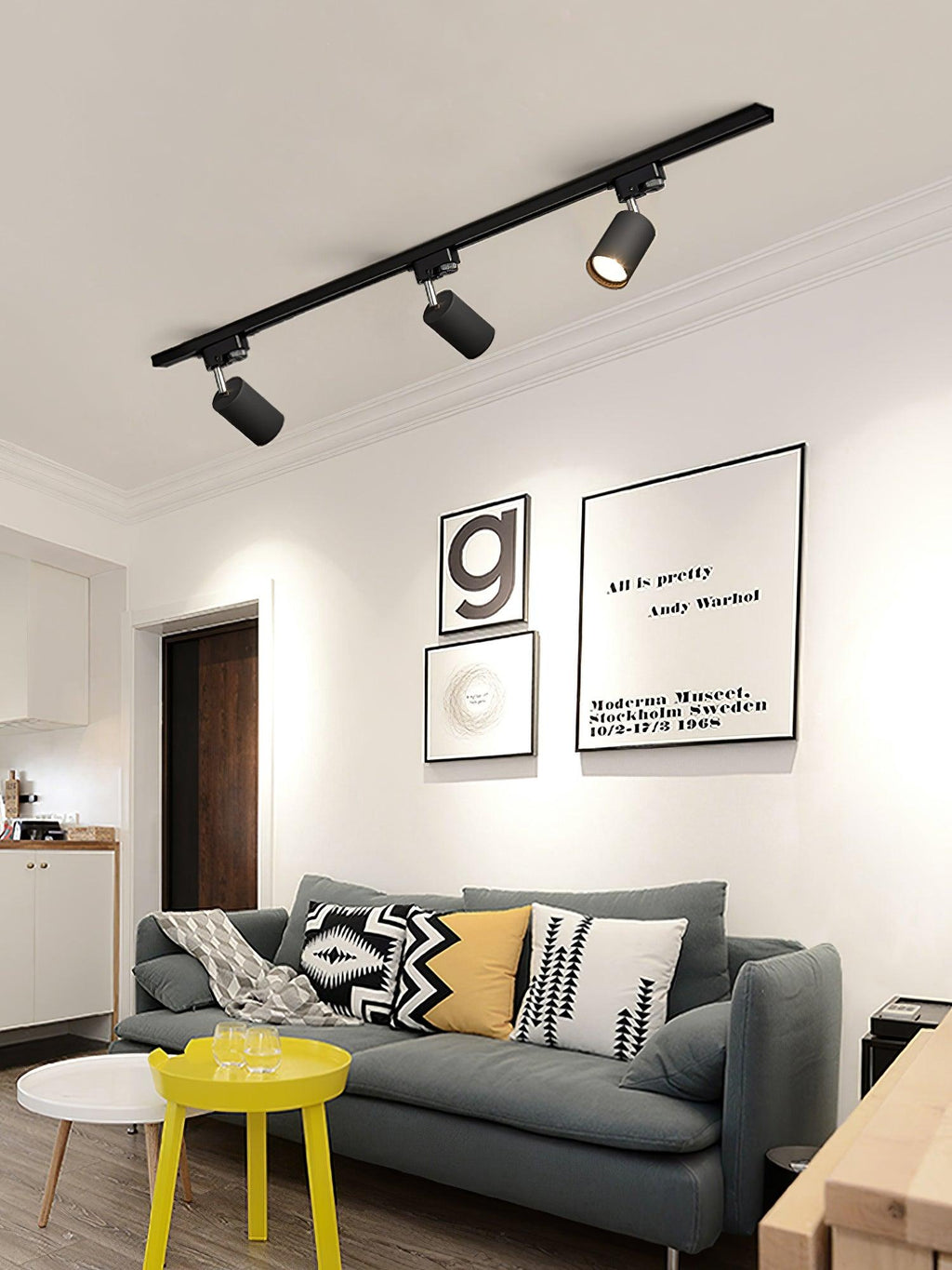 Track ceiling light spotlights illuminating an office workspace