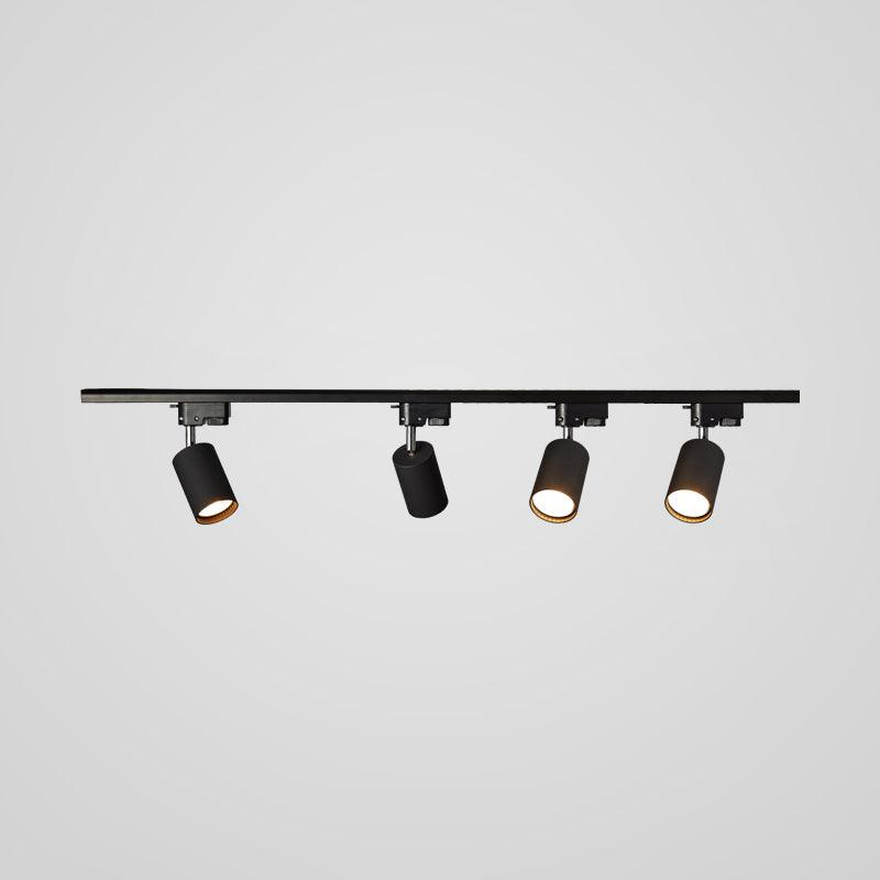 Track ceiling light heads rotated to direct focused beams
