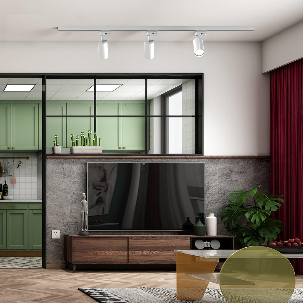 Track ceiling light shown lit in a warm interior setting