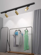 Track ceiling light installed over a dining area