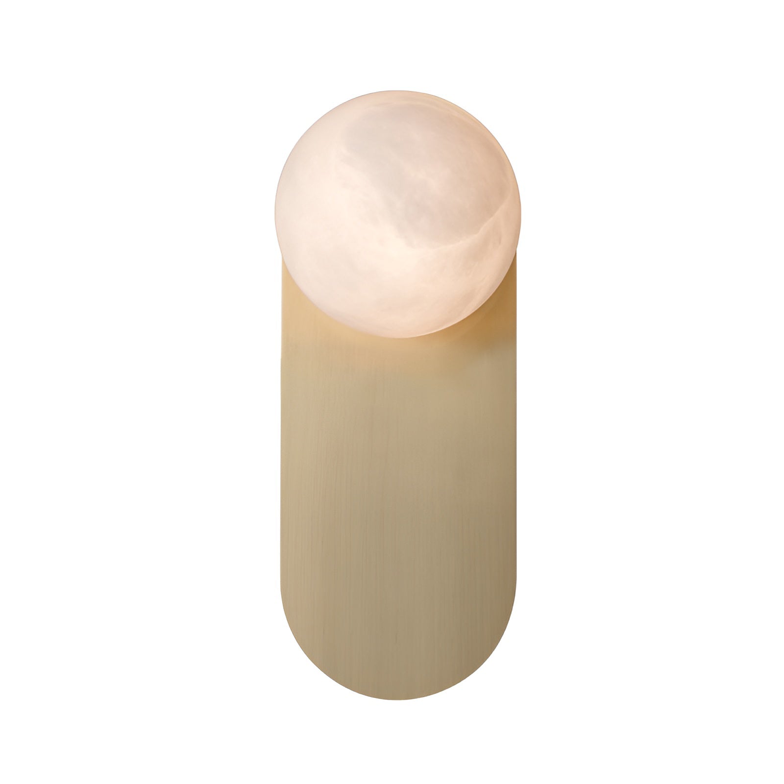 Adela wall sconce lit on a white background, the alabaster disc glowing warm and spilling light onto the brass