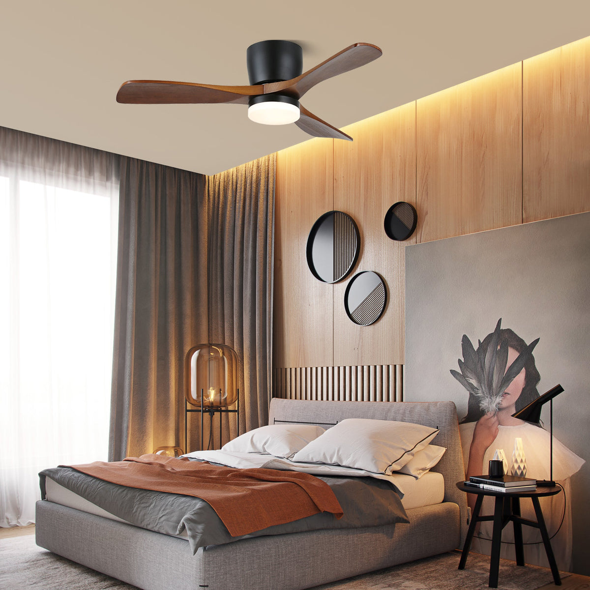 This Clérachic ceiling fan glows warm above a bedroom with round wall mirrors and warm uplighting on the panelled wall.
