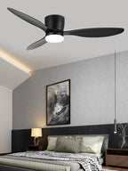 Black blades turn on this Clérachic ceiling fan, glowing warm above a grey bedroom with a slim pendant light.