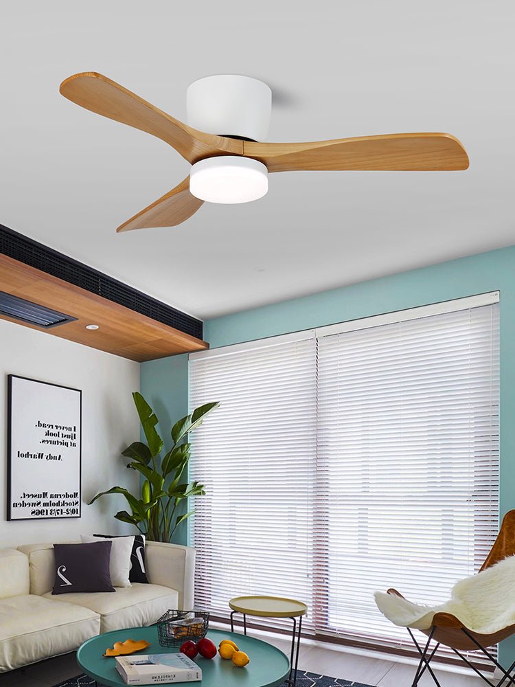 Nature wood-grain blades turn on this Clérachic ceiling fan above a teal-walled living room with blinds and potted plants.