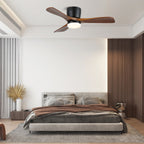 In a warm-toned bedroom, this Clérachic ceiling fan glows warm with walnut wood-grain blades and a black motor housing.
