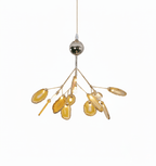 Natural agate chandelier glowing warmly above a room