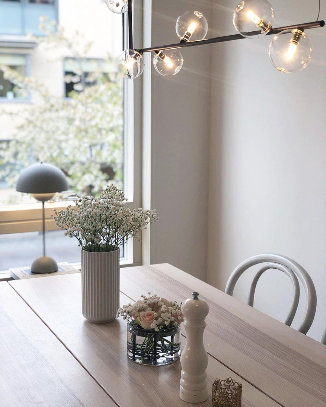 Glass sphere pendant light illuminated in a contemporary interior