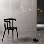 Geometric glass pendant light over a dining table setting