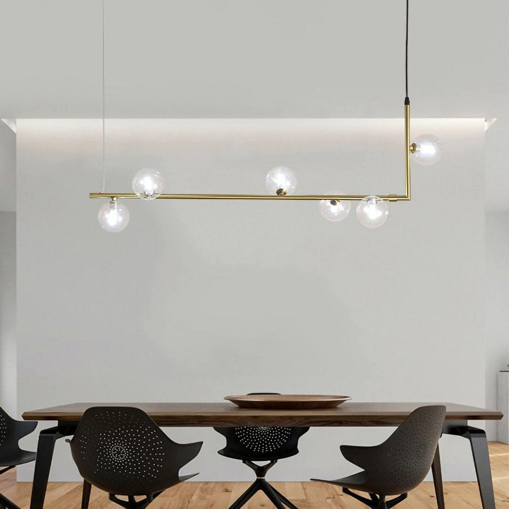 Clear glass pendant light with multiple lit globes