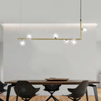 Clear glass pendant light with multiple lit globes