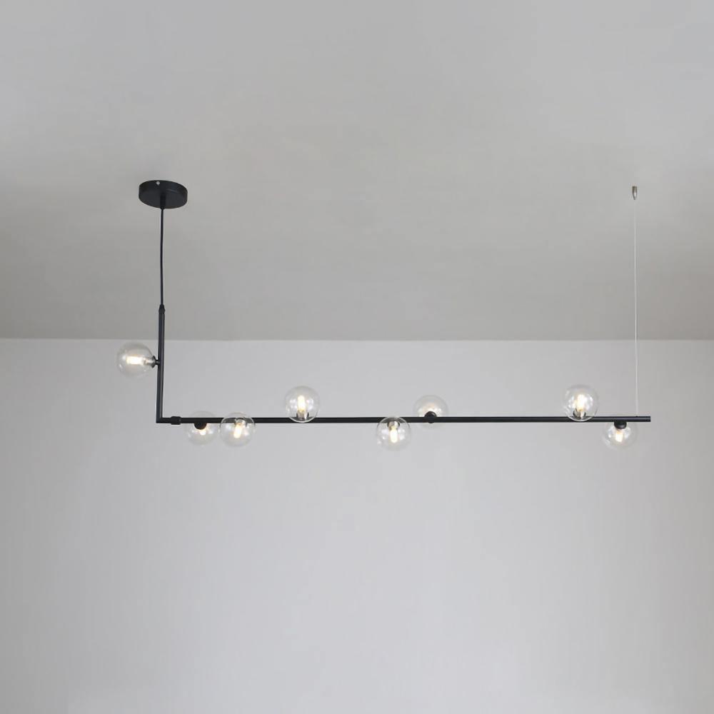 Glass sphere pendant light suspended in a bright interior