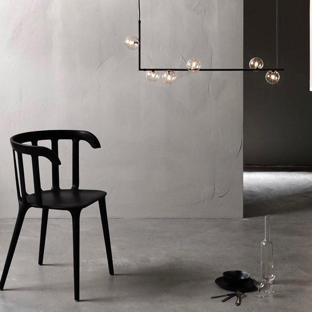 Right-angle steel pendant light holding clear glass spheres