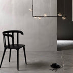 Right-angle steel pendant light holding clear glass spheres