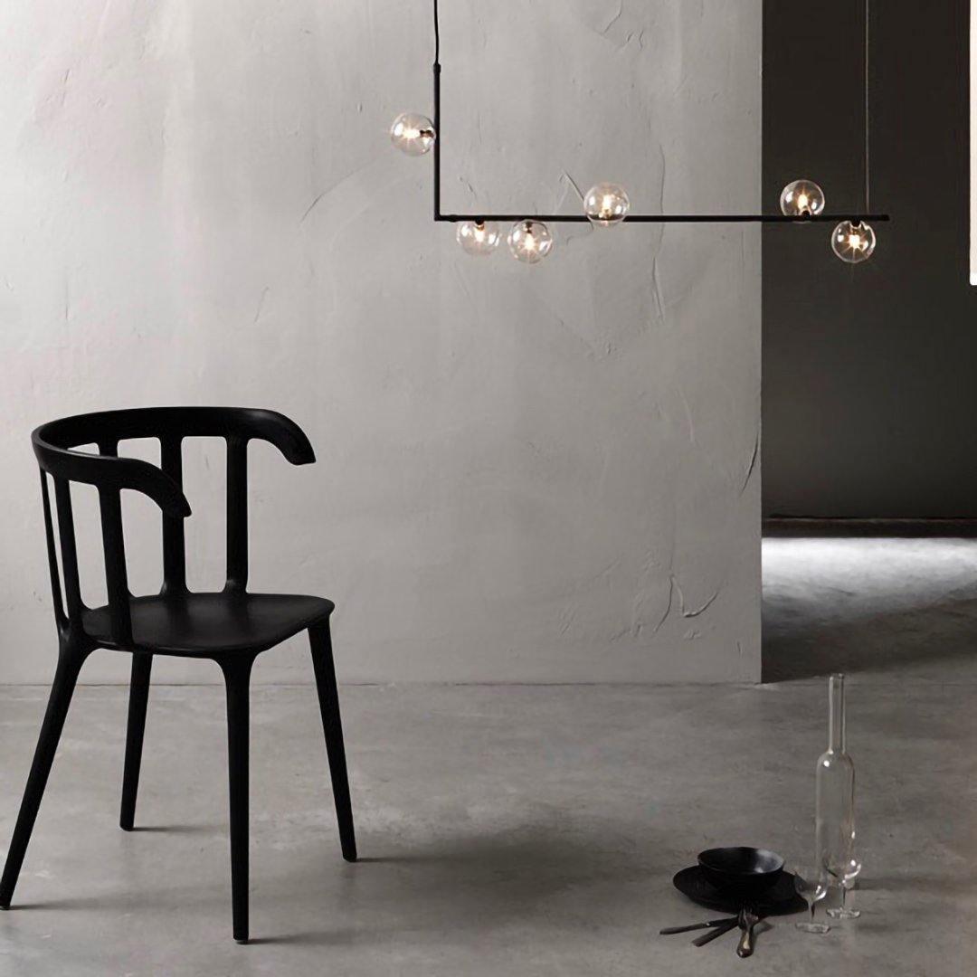 Right-angle steel pendant light holding clear glass spheres
