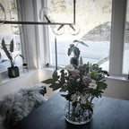 Geometric glass pendant light suspended in a modern space