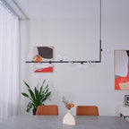 Linear pendant light with clear glass spheres and steel frame