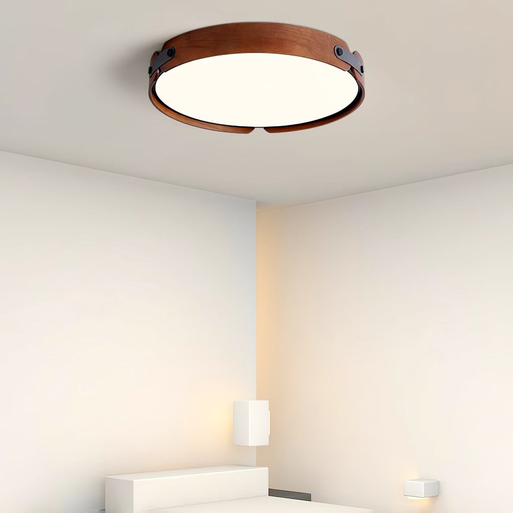 Wood-tone flush ceiling light in a minimal interior
