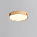 Round wood-finish flush ceiling light glowing softly overhead