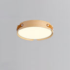 Round wood-finish flush ceiling light glowing softly overhead