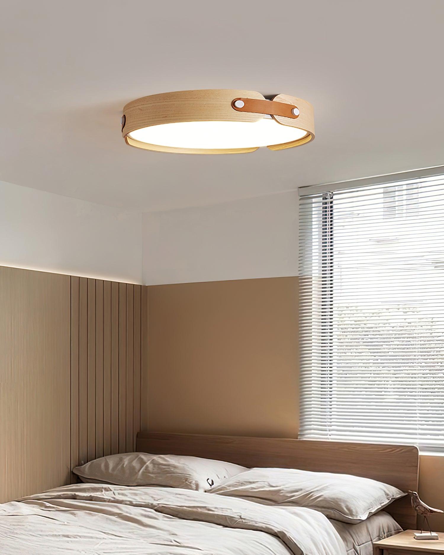 Slim wooden ceiling light glowing in a bedroom
