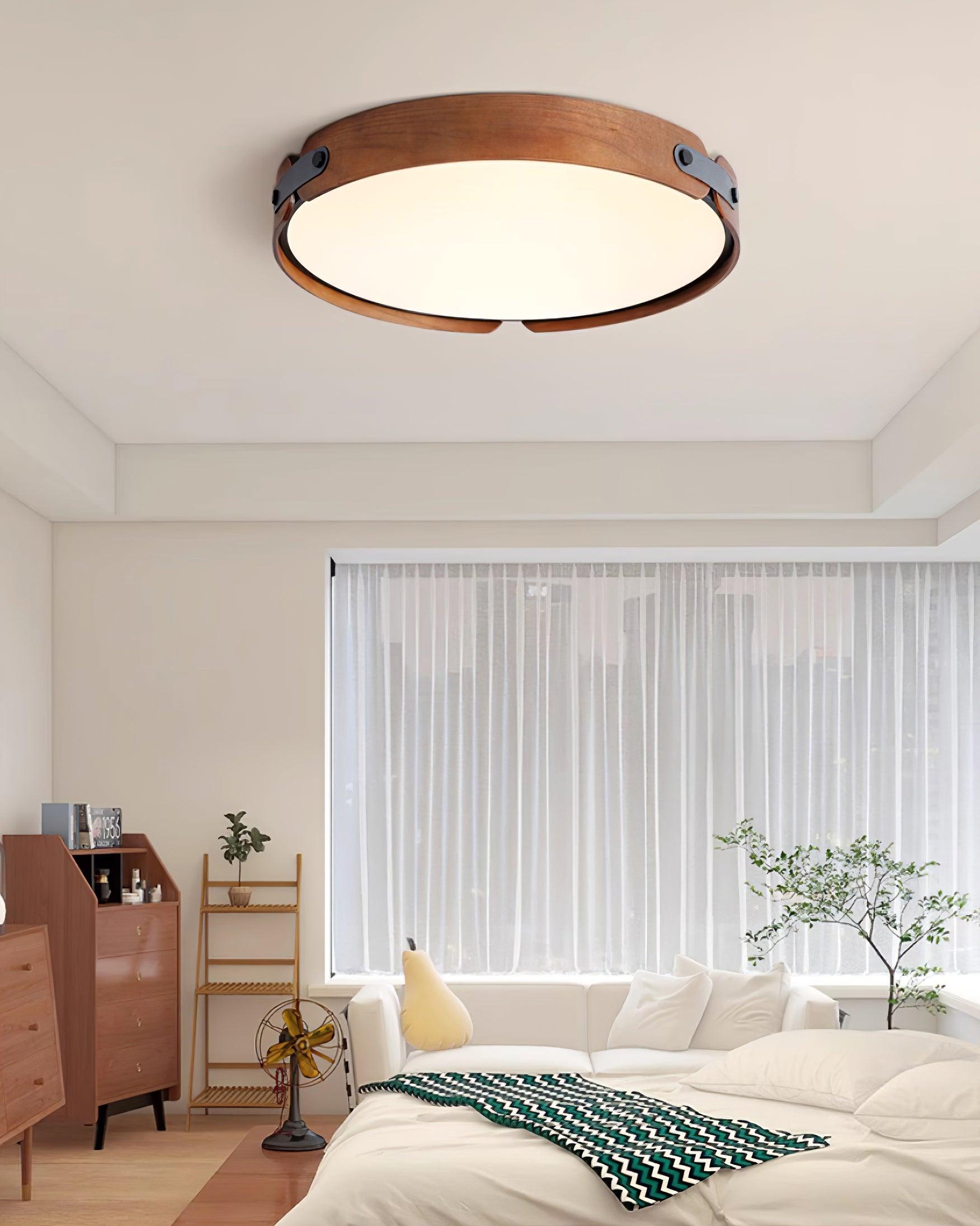 Round wood-finish ceiling light close detail view