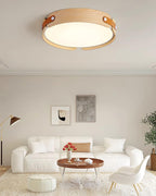 Wood-tone flush ceiling light glowing overhead