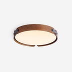 Wooden flush ceiling light glowing in a styled space
