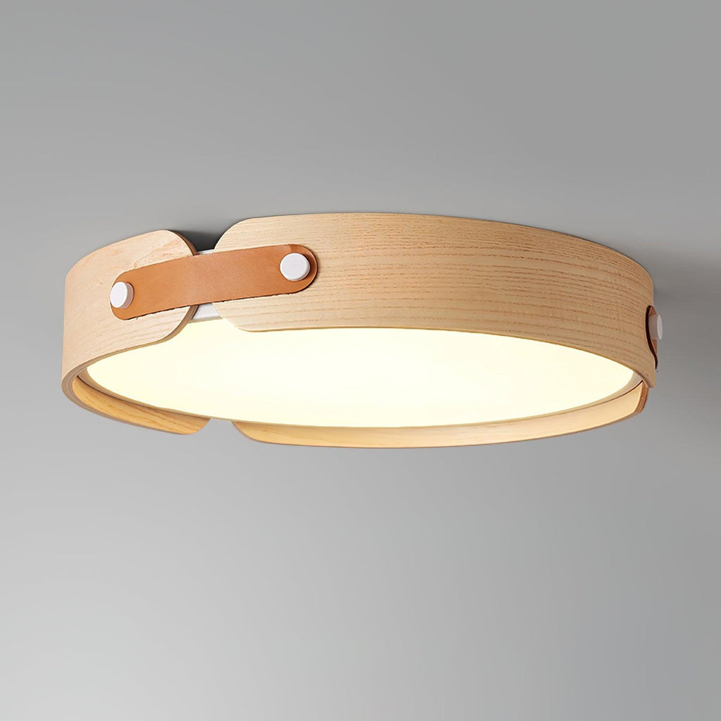 Round wooden ceiling light glowing softly at night