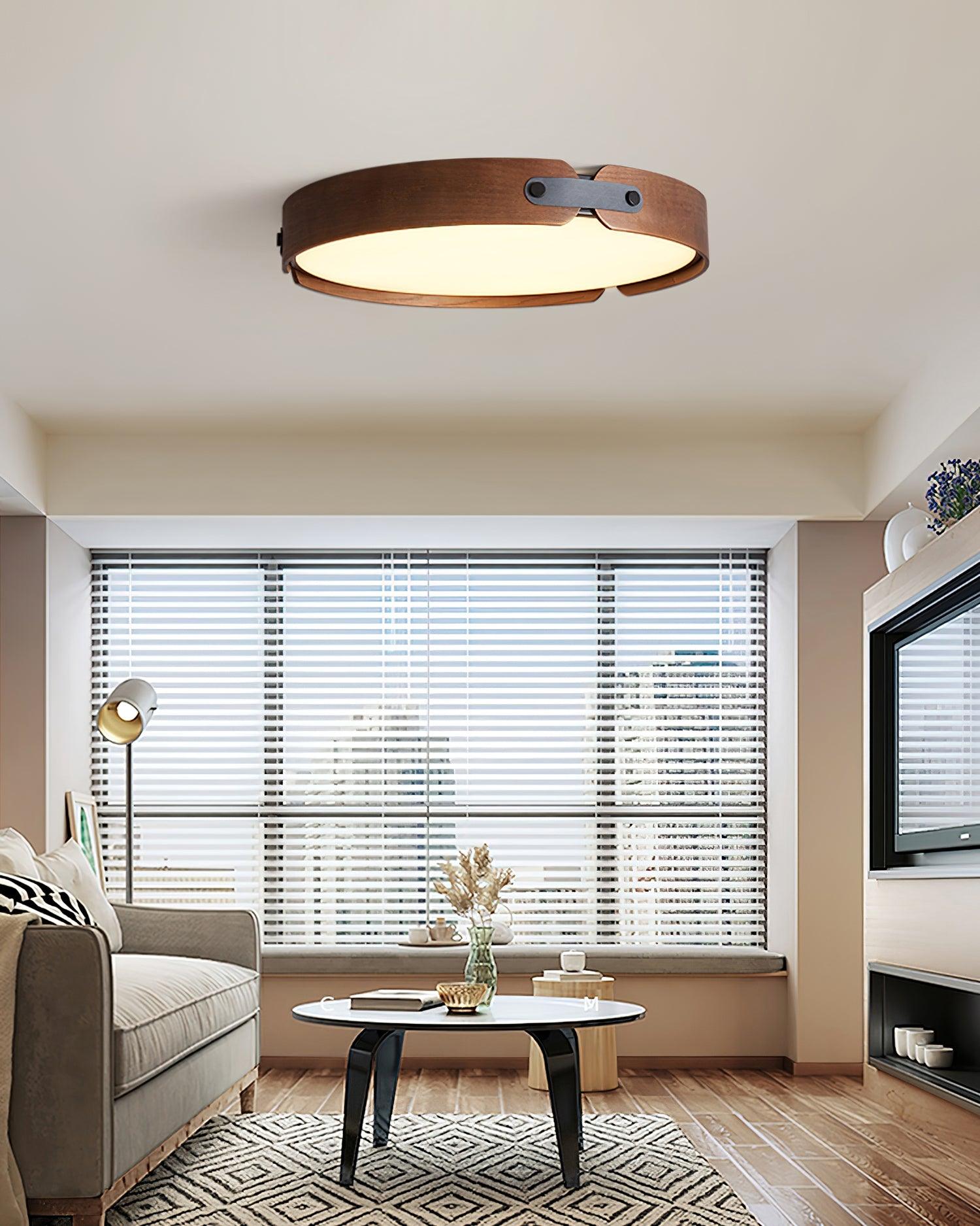 Wood ceiling light lit warmly in a living space