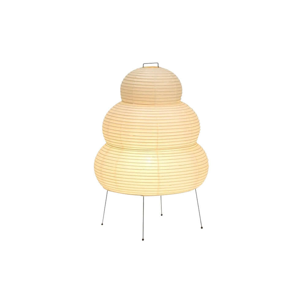 Paper lantern table lamp glowing softly on a side table