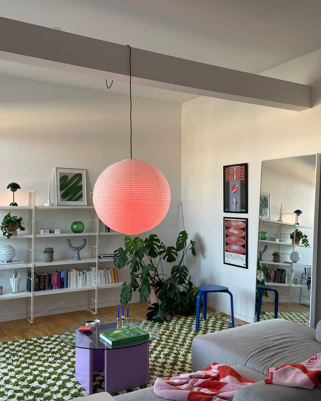 Paper globe swag pendant light on a white cord
