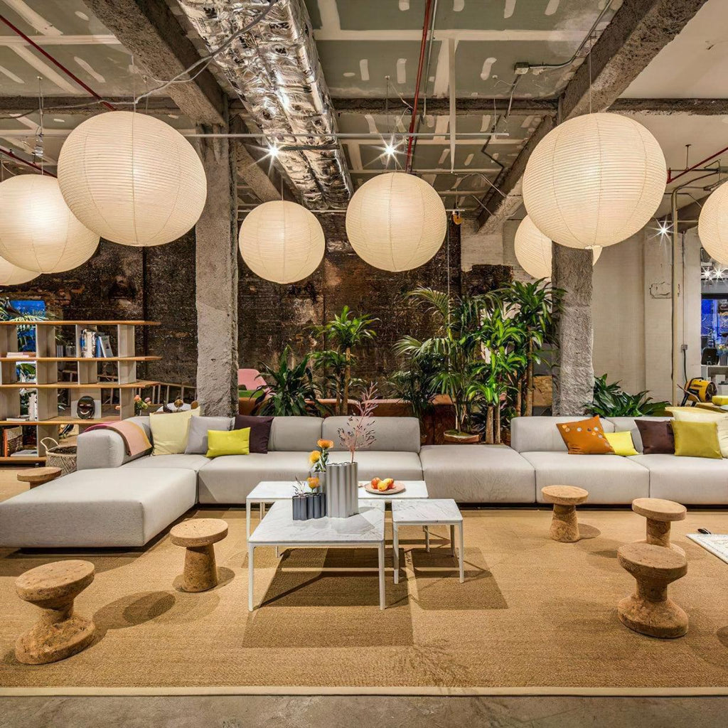 White paper globe pendant light hanging in a calm space