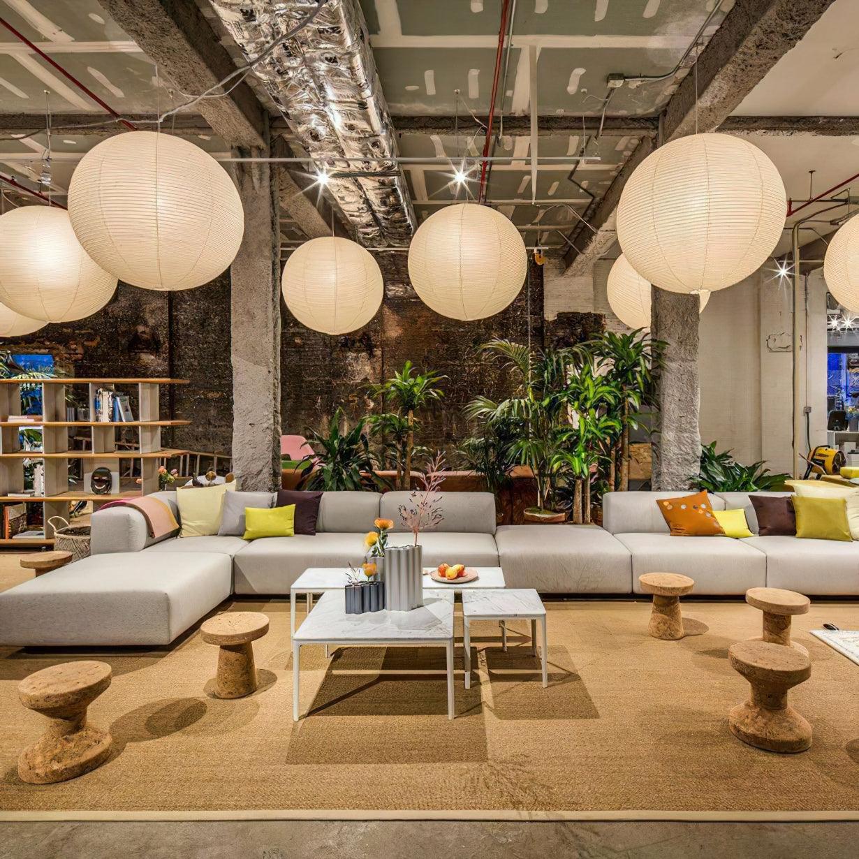 White paper globe pendant light hanging in a calm space