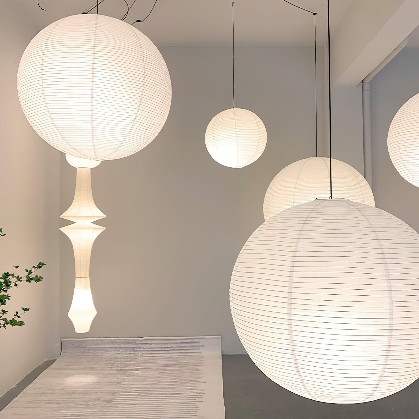 Paper globe swag pendant light hanging in a bright room