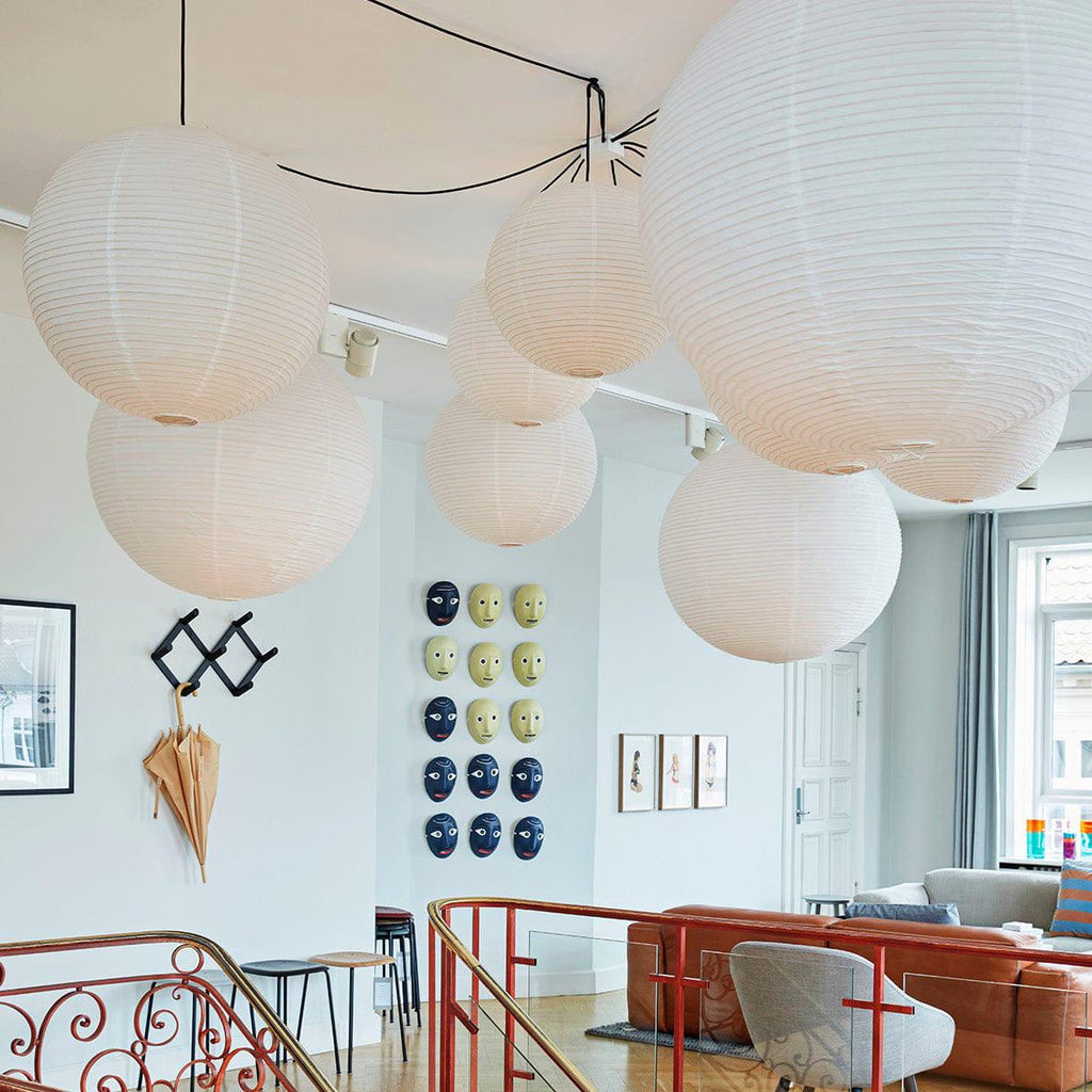 Mulberry paper globe pendant light over a styled space