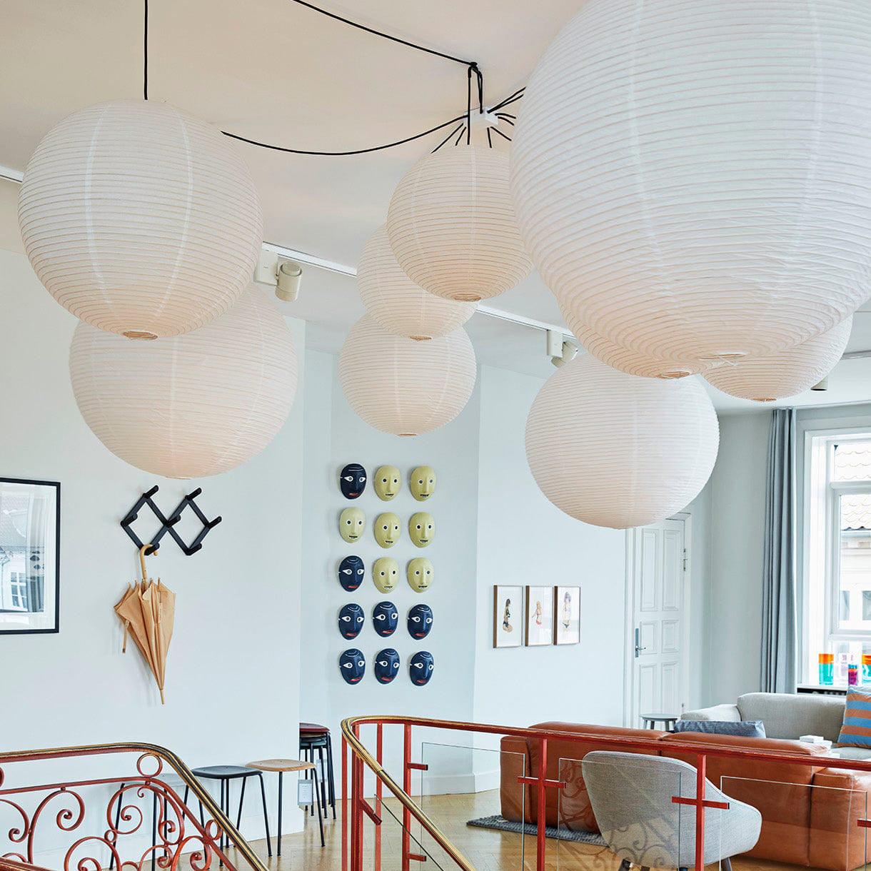 Mulberry paper globe pendant light over a styled space