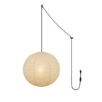 Paper globe swag pendant light glowing with a black cord