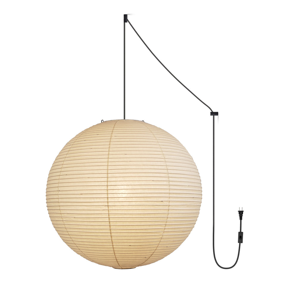 Paper sphere pendant light shown against a neutral wall