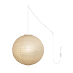 Paper sphere pendant light shown against a pale wall