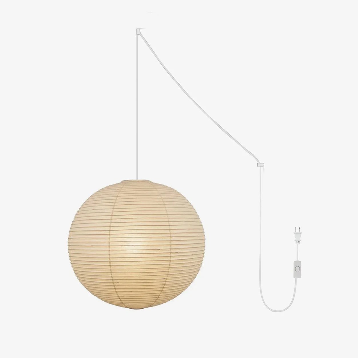 Round mulberry paper pendant light lit warmly in a room