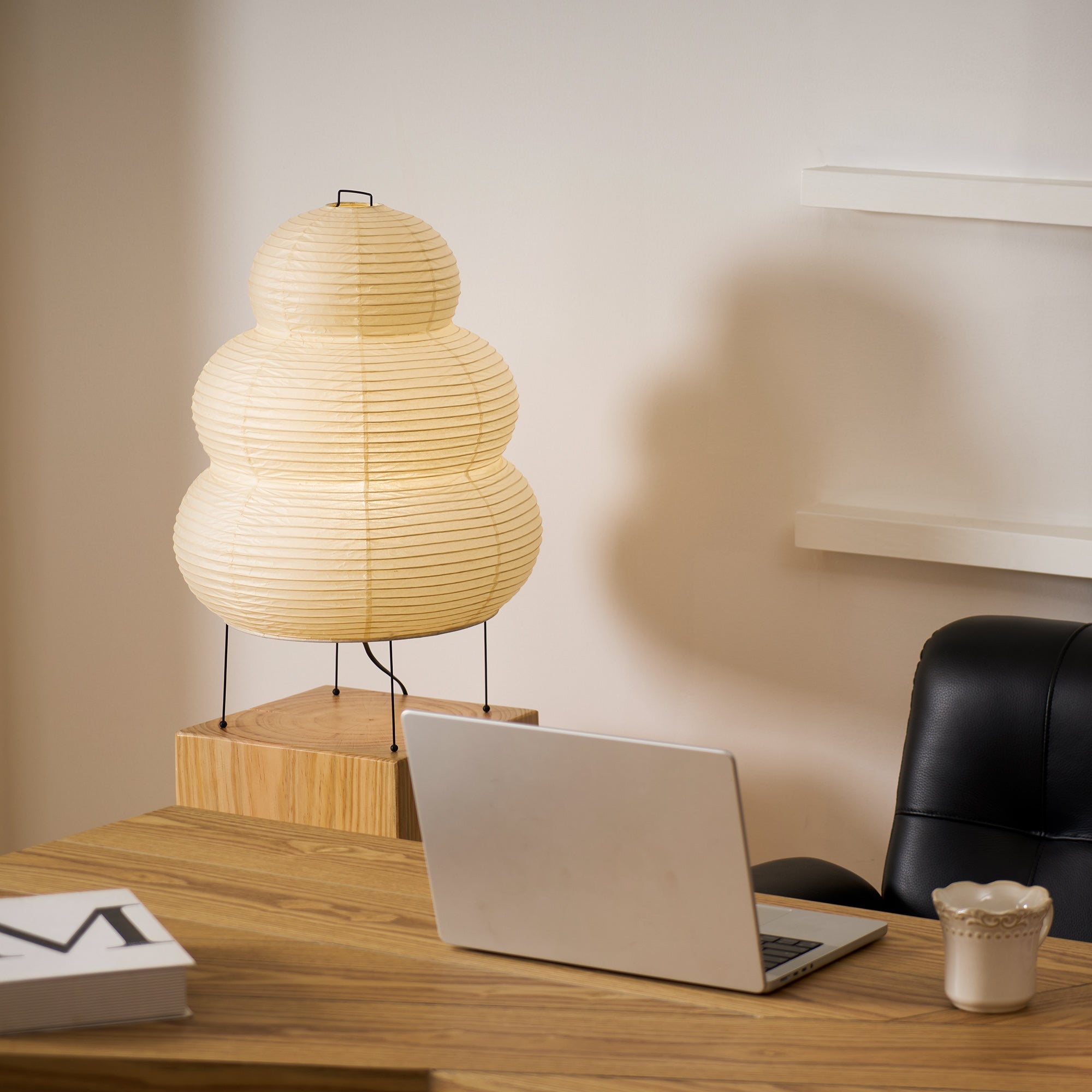 Xuanzhi paper table lamp casting a gentle glow in a room