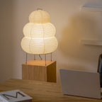 Xuanzhi paper table lamp glowing in a relaxed interior