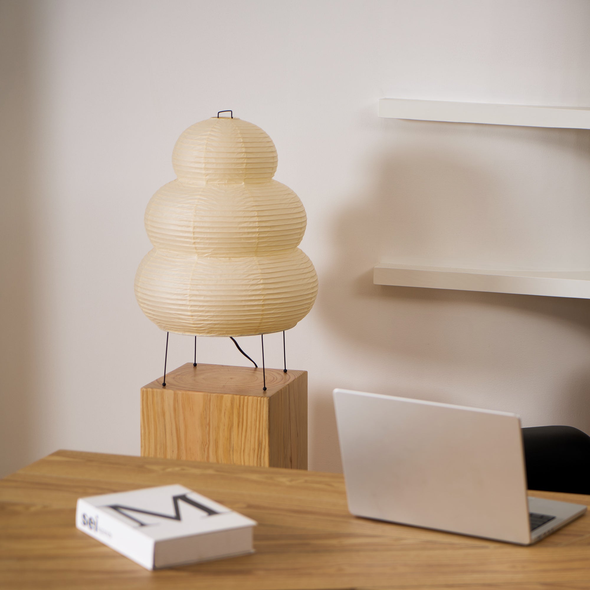 Paper lantern table lamp glowing softly in a warm interior