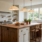 Alabaster dome pendant glowing warmly above a styled dining table