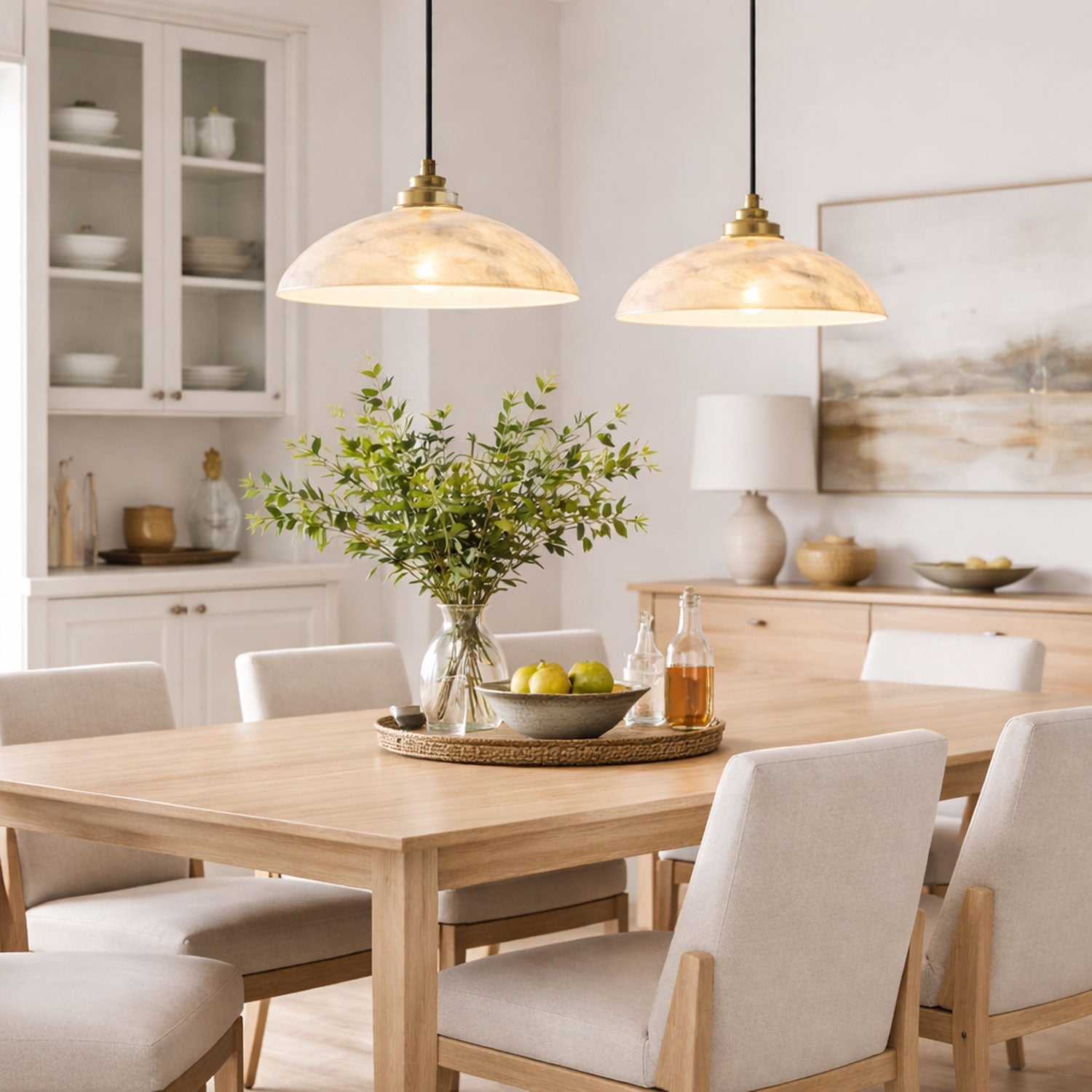 Alabaster dome pendant light glowing warmly in a dining area