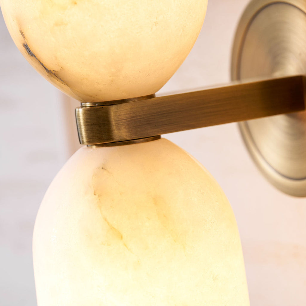 White alabaster nexus wall light showing unique stone veining