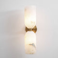 Square crop of the lit Nexus Modern Alabaster Wall Light, showing the veined lower shade and metal collar.