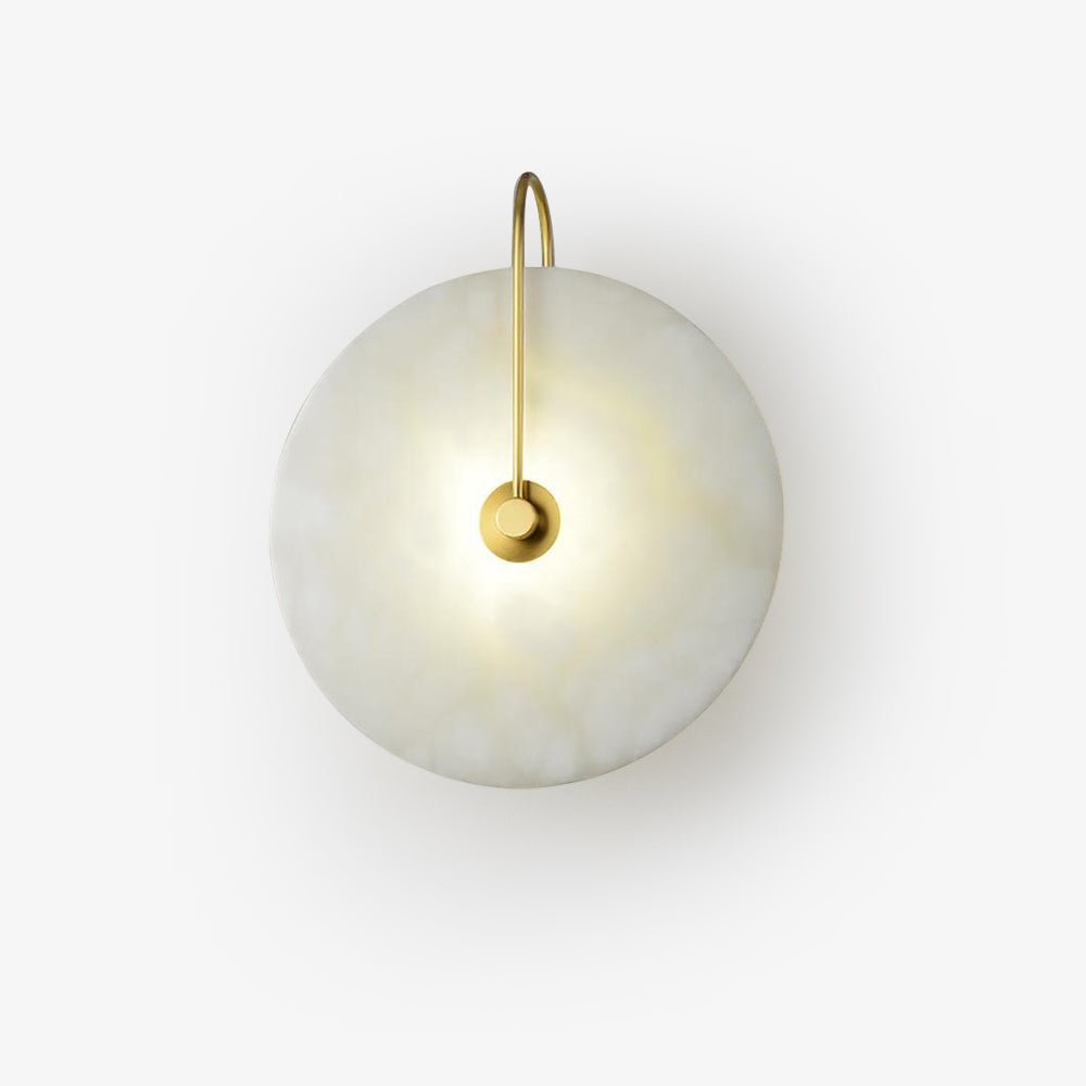Product view of the lit gold Elaris wall light on white, arm arching down to the central mount.