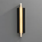 Blade wall light on a grey wall, a lit alabaster strip crossing a black metal backplate.