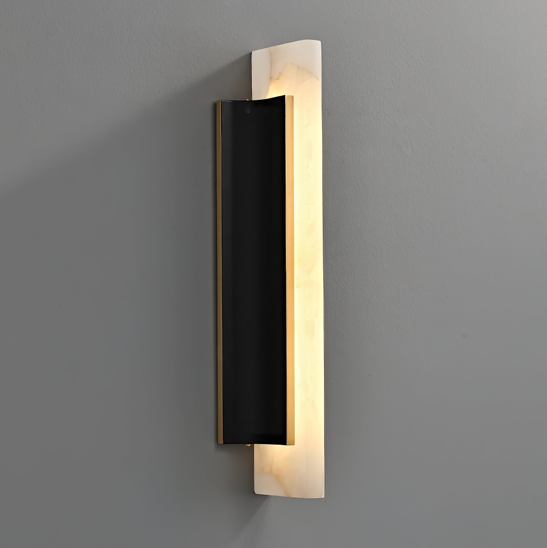 The fixture on grey, angled so the depth of the black backplate is visible.